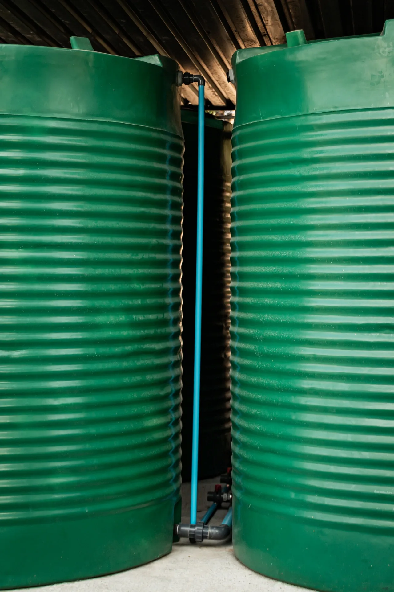 Green steel water storage tanks installed at a commercial shopping centre in Johannesburg, ensuring reliable water supply continuity.