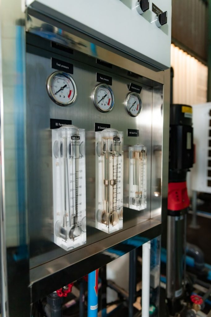 Close-up of gauges and flow meters on the RO system inside the facility’s water-treatment area as part of the Turnkey Water Management Solution.