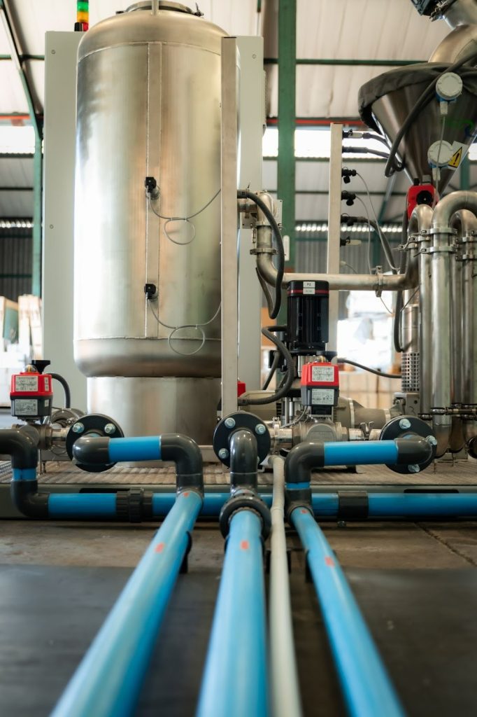 Stainless-steel heating tank and interconnected piping supplying temperature-controlled water to the AdBlue production line as part of turnkey water management solution.